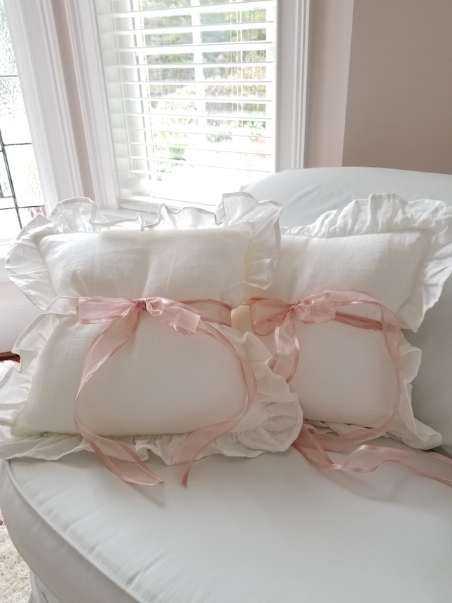 White Ruffle Pillows with PInk Ribbons